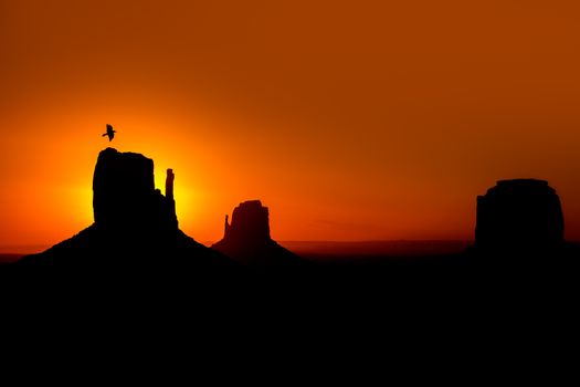 Sunrise at Monument Valley at Mittens and Merrick Butte