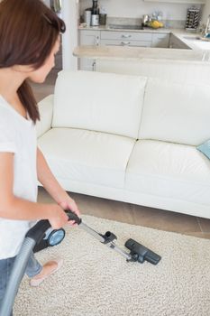 Woman cleaning the carpet