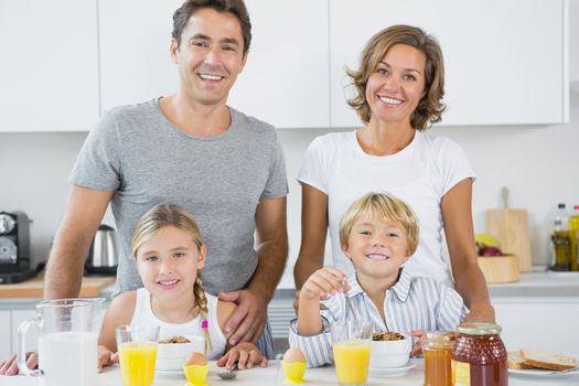 Happy family at breakfast