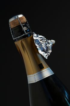 Top of bottle of champagne with ripped foil