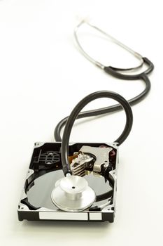 Disk drive with stethoscope resting on it