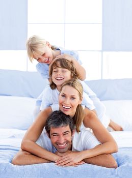 Family piled on top of dad