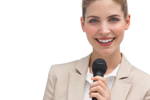 Classy businesswoman holding microphone