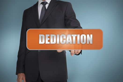 Businessman selecting the word dedication written on orange tag 