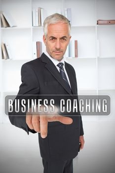 Businessman selecting the term business coaching
