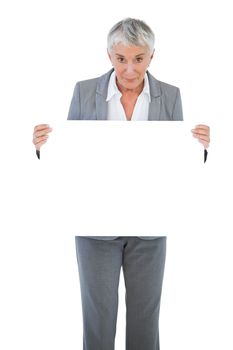 Happy businesswoman holding blank sign