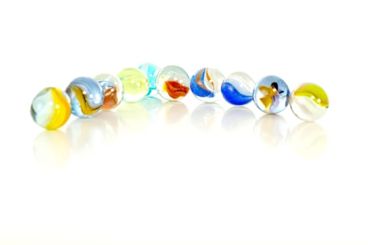 Colourful marbles on white background