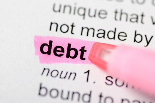 Pink marker on debt word 