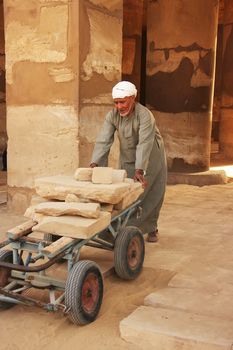 Local man working at Karnak temple complex, Luxor
