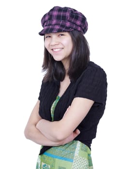 Young teen girl smiling, arms crossed, wearing hat