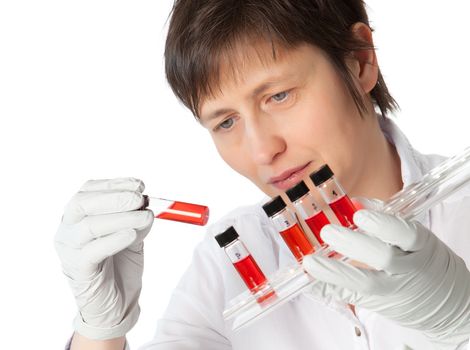 Isolated scientist woman in lab coat with  liquid samples.