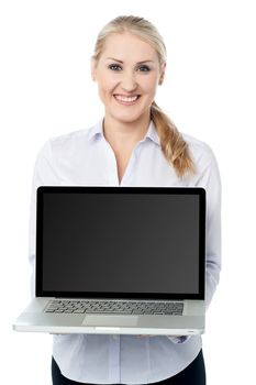 Saleswoman presenting brand new laptop