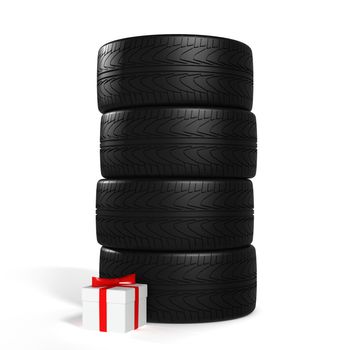 Four New Car Tires and White Gift with Red Ribbon On the White