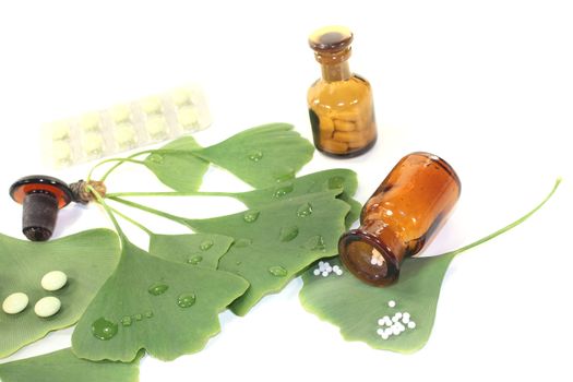 Ginkgo leaf with pills and pharmacist bottle