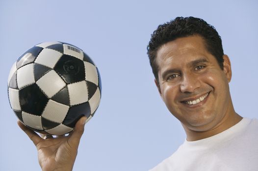 Man Holding Soccer Ball close-up