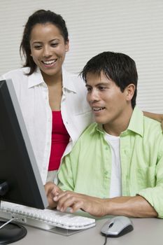 Couple Using Computer at desk