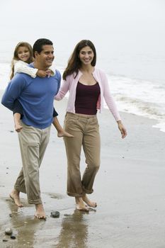 Family walking on beach