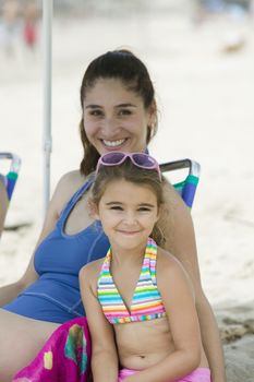 Portrait of mother and daughter on beach