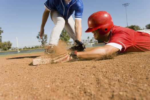 View of a runner and an infielder reaching the base