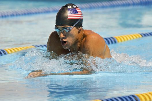 American male participant competing in a swimming race