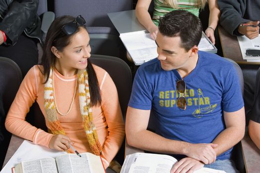 Student couple sitting in lecture hall