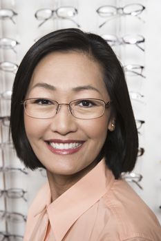 Portrait of a mid adult Chinese woman wearing glasses