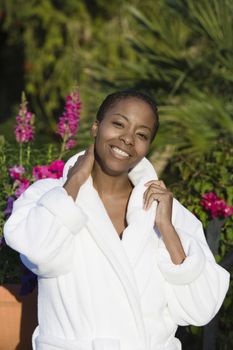 Portrait of an African American woman in bathrobe smiling
