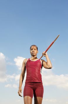 African American athlete woman ready to throw javelin