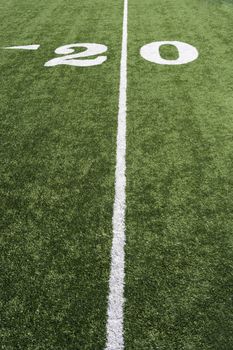 20 yard line on American football field in stadium