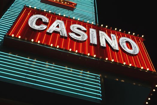 Neon casino sign at night low angle view
