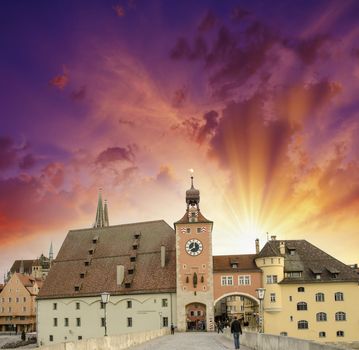 Beautiful sunset sky over medieval city skyline. Middle-Age buil