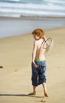 Boy Playing on Beach