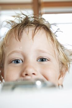 Closeup portrait of happy boy in bathtub