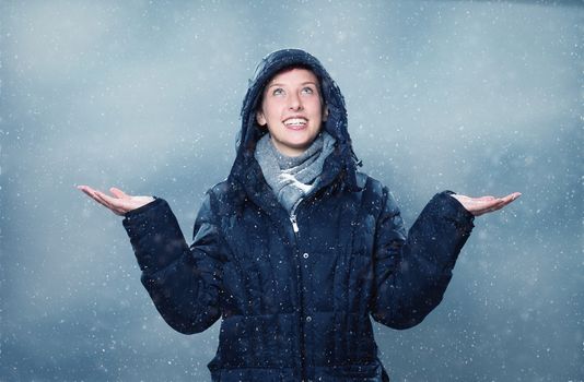 woman is happy about snowfall