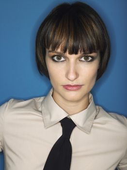 Woman wearing tie head and shoulders in studio
