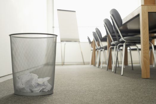 Trash Can in Empty Meeting Room