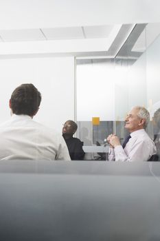 Happy multiethnic business people in conference room