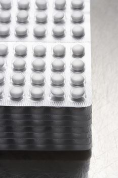 Stack of pills in packaging close-up
