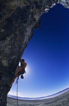 Rock climber on cliff face