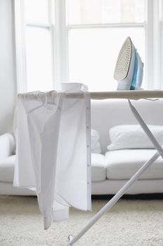 White shirt on ironing board in living room