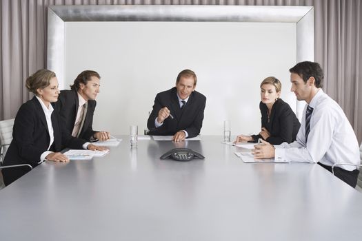 Businesspeople Listening During Teleconference
