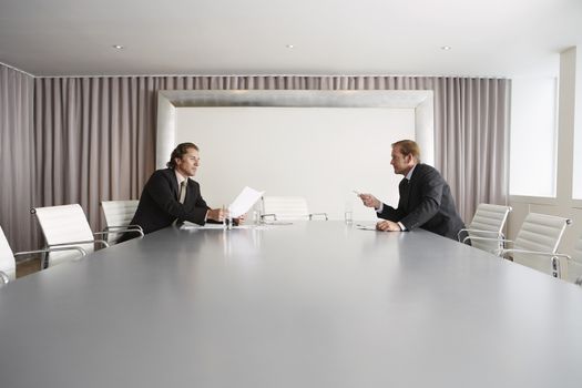 Two businessmen having a discussion in conference room