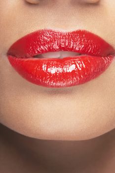 Closeup of sensuous woman wearing red lipstick