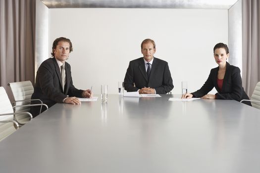Portrait of confident multiethnic business people in conference room