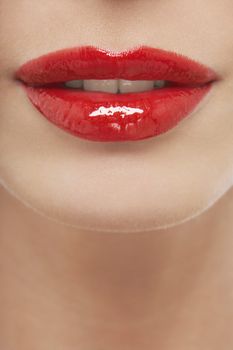 Closeup of seductive young woman with red lips