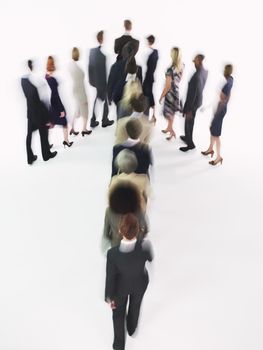 Group of Businesspeople walking in arrow formation