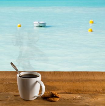 Morning cup of coffee by warm caribbean sea