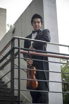 asia man with his violin