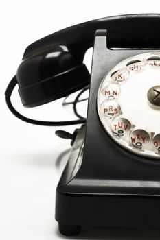 Closeup of old fashioned telephone isolated over white background