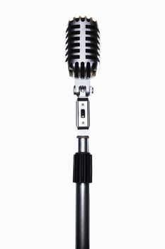 Old fashioned microphone isolated over white background